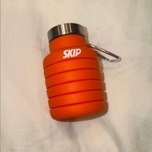 Collapsible Orange SKIP Water Bottle with Silver Cap